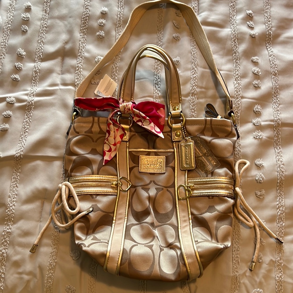 Coach Gold Handbag with Pink Bow